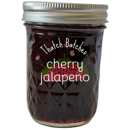 A jar of cherry jalapeño jam. It is sweet, spicy, and very cherry.