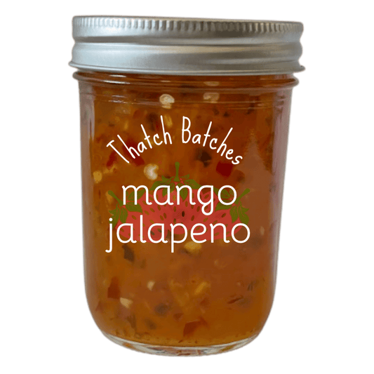 A jar of mango jalapeño jam is a great tasting snack with some crackers and cream cheese!