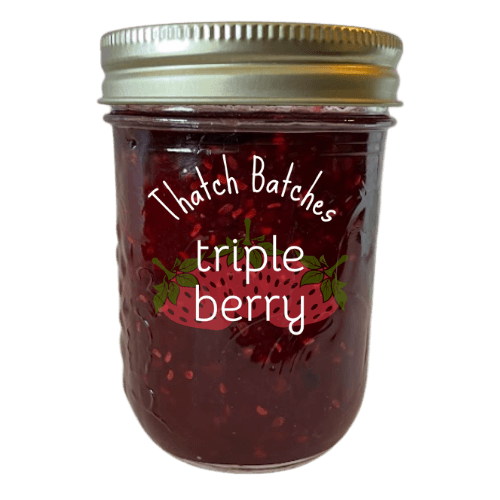 A jar of triple berry jam is made of the best combination of three berries: strawberries, blackberries, and raspberries.